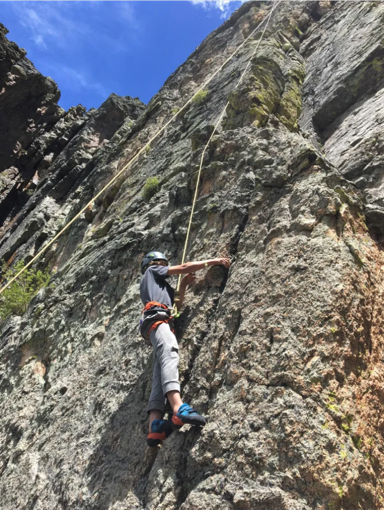 a rock climber on the via ferrata
